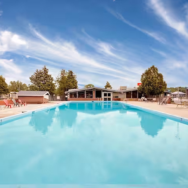 The outdoor pool at Ramada by Wyndham Gananoque Provincial Inn.