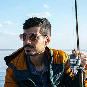 A fisherman holding a fishing rod.