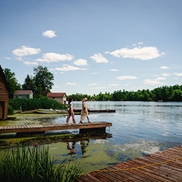 Two people walk on a dock