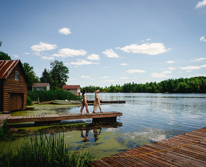 Two people walk on a dock