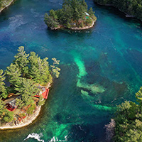 The emerald-green waters of the St. Lawrence River.